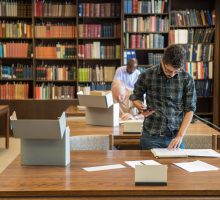Researchers in a library