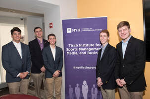 5 individuals are posed with a NYU conference banner