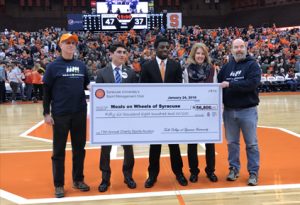 A large check is presented in the Dome
