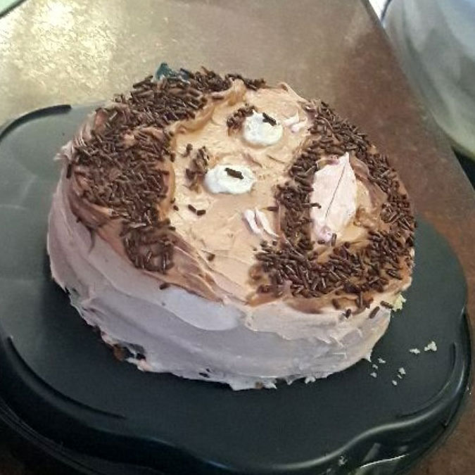 A round cake decorated like a face