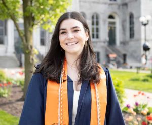 Alexa is posed in her graduation gown