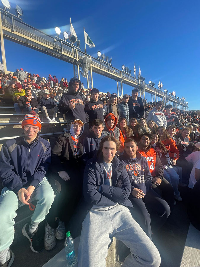 Sport management club members attending event at outdoor stadium