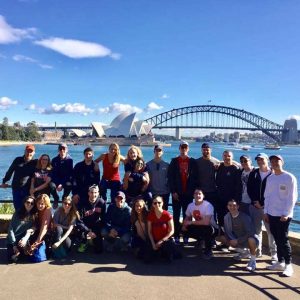 Students are posed overlooking a river