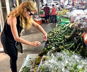 A women near vegetable stands