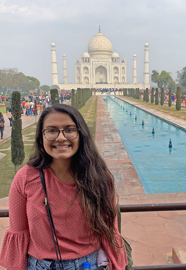 BijalPatel stands with the Taj Mahal in the background