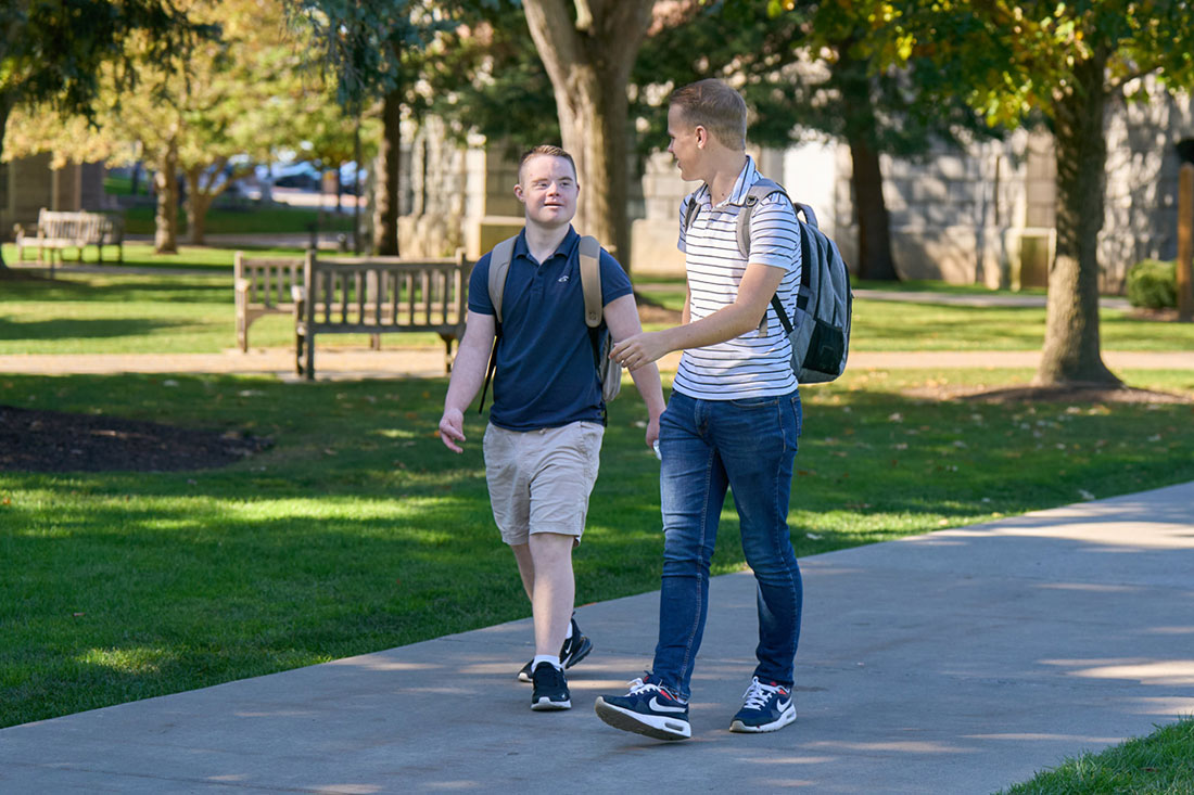 Two brothers walking together on SU campus