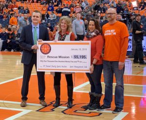 A large check is presented in the Dome