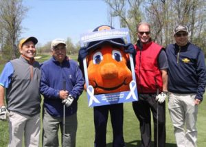 Otto posed with golfers