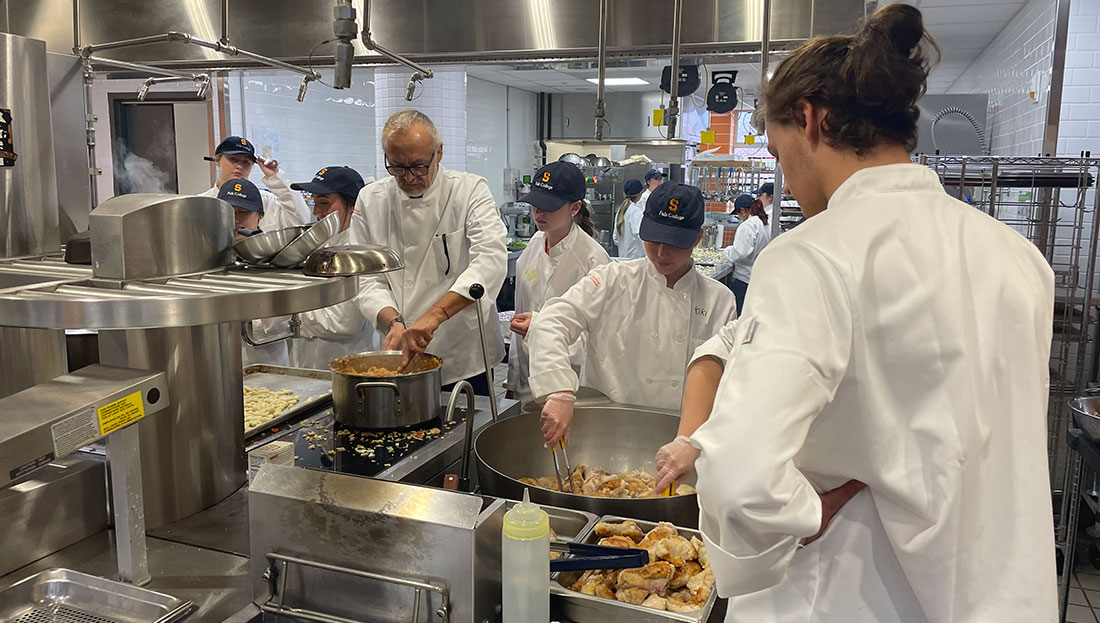 Chef Tendi in class with students