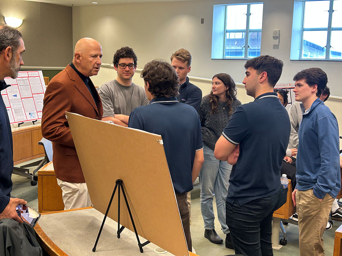 David Falk speaking with students