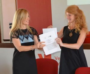 Professor Dessa Bergen-Cico posed with new agreement