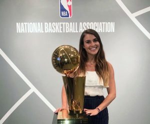 Drina Domic stands with NBA trophy