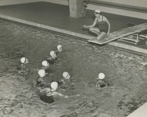 A 1953 photo of women in a pool