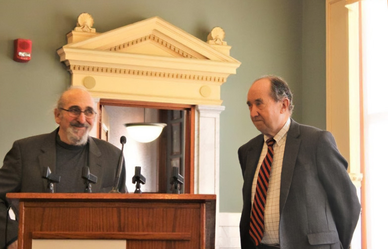 Eric Kingston and James Stone present in a court room