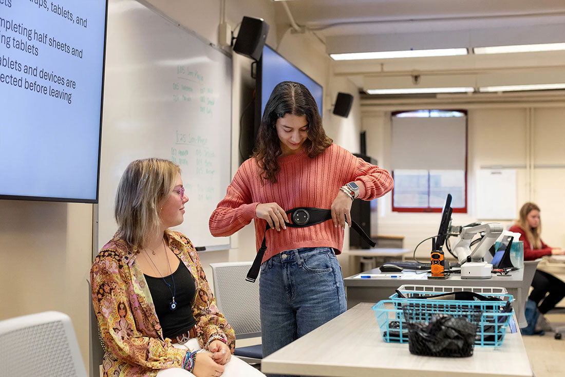 Student shows off electronic data collection device