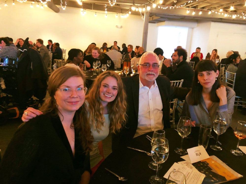 group shot of people at a dinner table