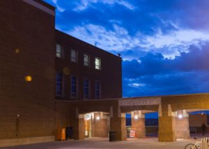 Falk College exterior at night