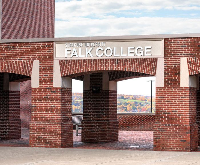 exterior view of Falk College facing brick patio