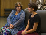 Dean Diane Lyden Murphy talks with a student in Grant Rotunda.