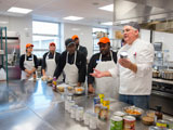 Chef Collins with "Flavor and Savor" participants in Falk College's Klenk Kitchens.