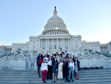 Students stand in front of the Capitol Building in Washington, DC
