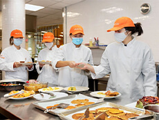 Medical students create healthy dishes in the Falk College Klenk Kitchens..