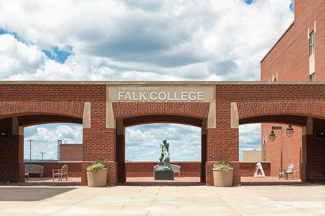 Exterior view of Falk College from Quad parking facing the patio