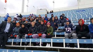Group of students sitting in bleachers