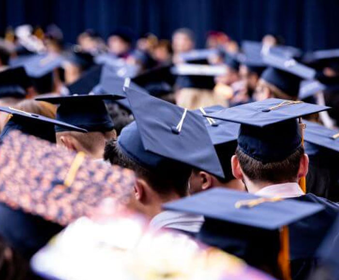 graduation hats on graduates