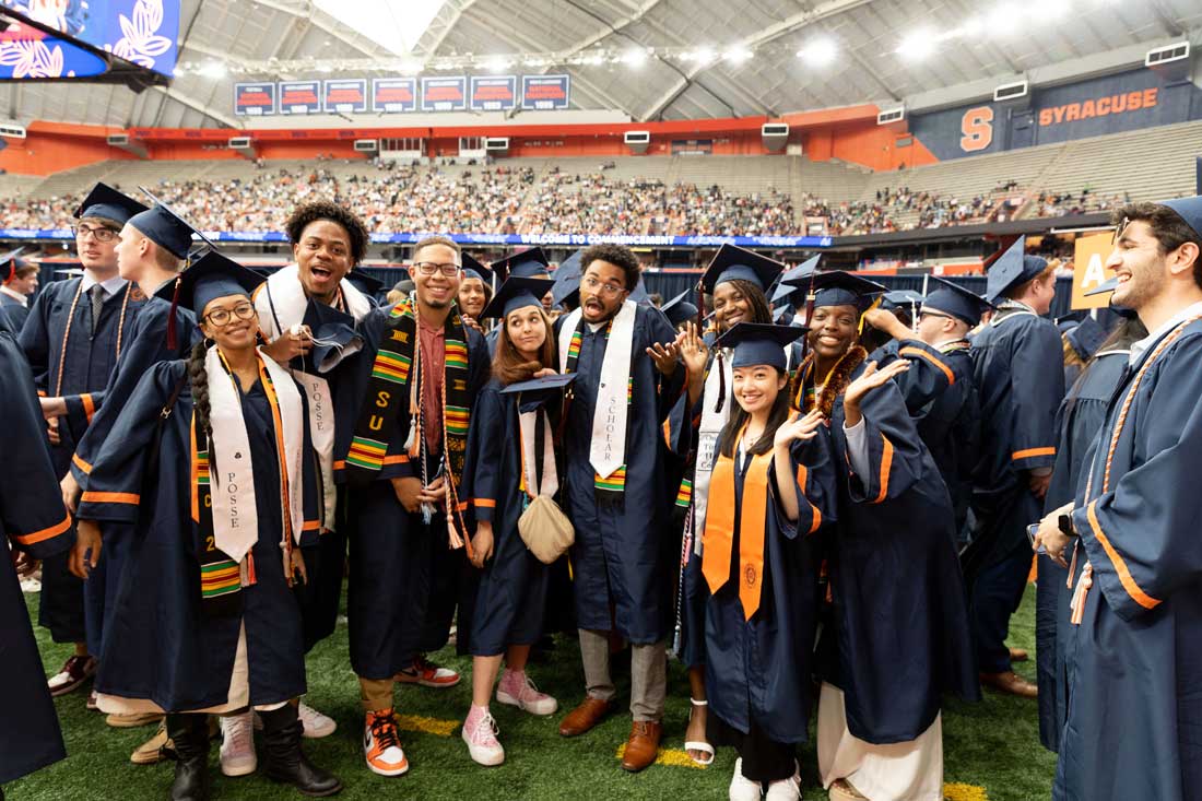 Graduates are posed together in the Dome on Graduation day.