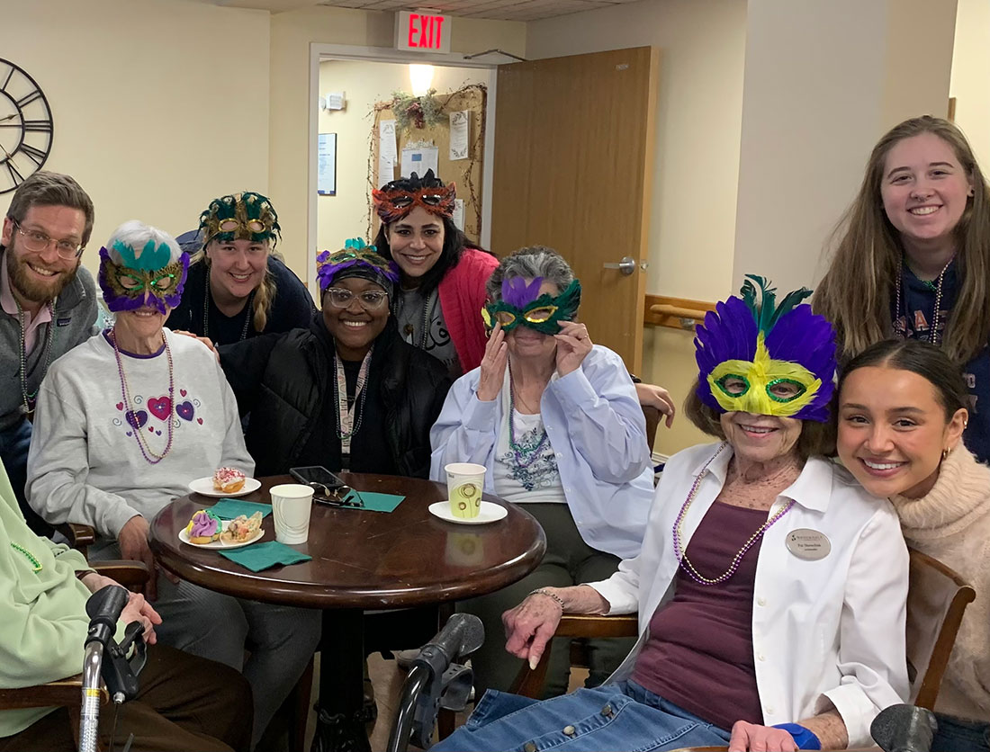 Social Workers United students from Falk College celebrating Valentine’s Day - and Mardi Gras - with residents from Brookdale Summerfield Senior Living in Syracuse.