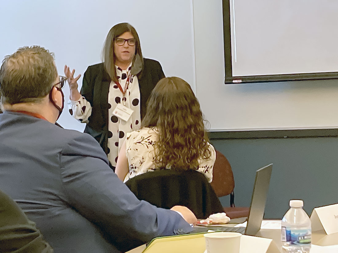 Jody presents in a conference room