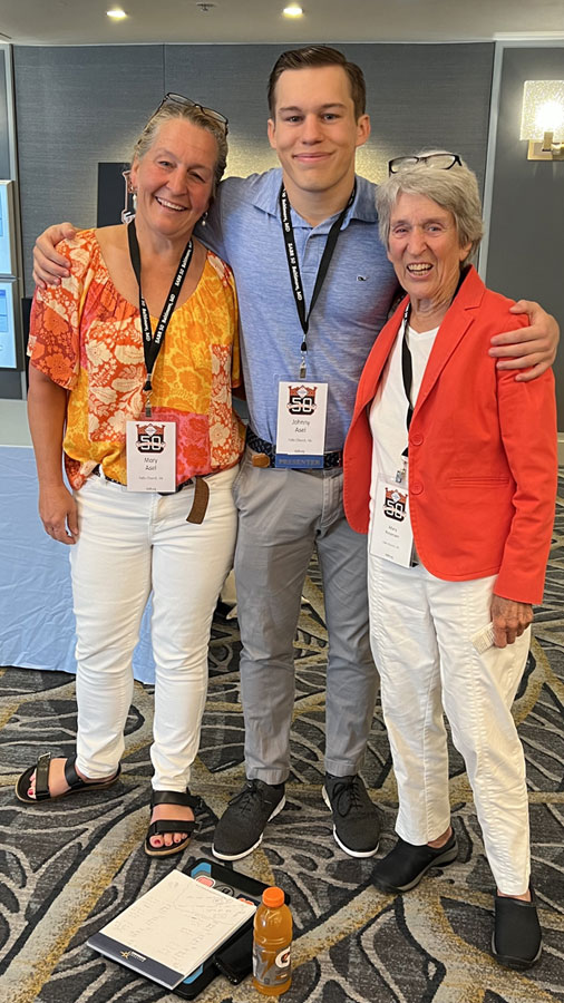 John poses with his mother and grandmother.