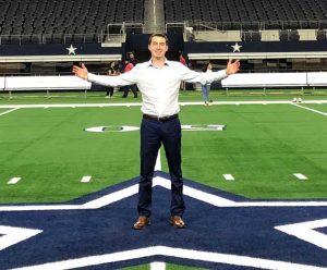 Josh Katz stands in a football stadium