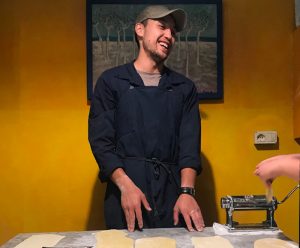 Justin Pascual making pasta in Italy as part of the Mediterranean Food and Culture course.