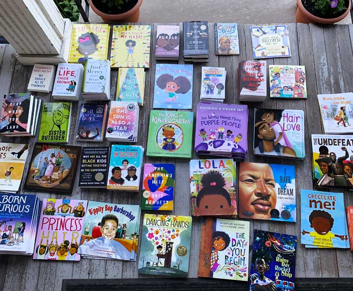 Books are laying out on a porch