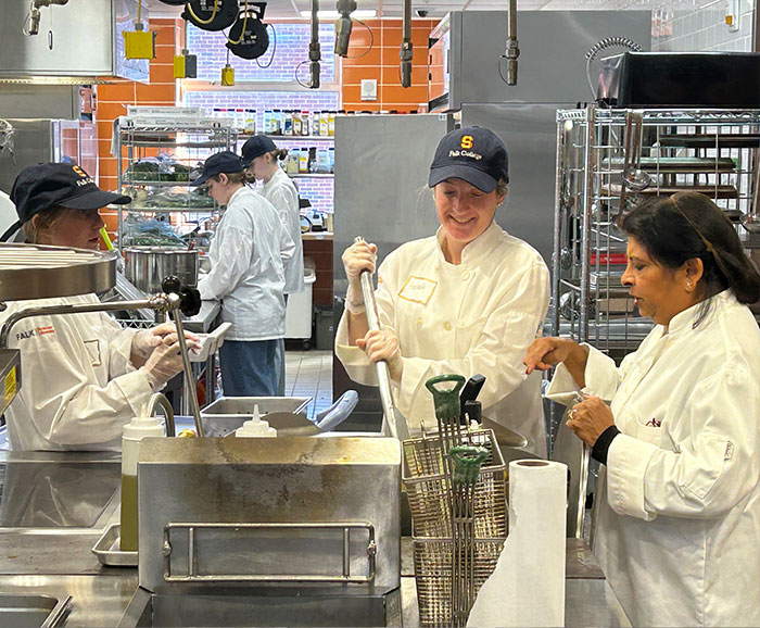 Students working in Klenk kitchen with Chef Gadia