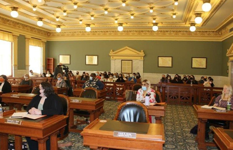 a group of people fill a courtroom