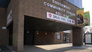 Exterior of Southwest Community Center with a banner saying "Drug Free Zone"