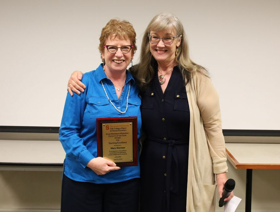 Mary Kiernan accept her award from Margaret Voss
