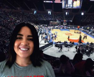 Montana Tyrus poses in front of a basketball court