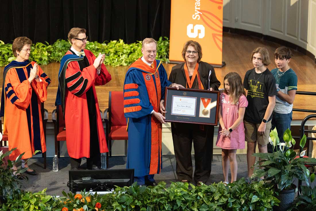 Diane receives and award from Chancellor 