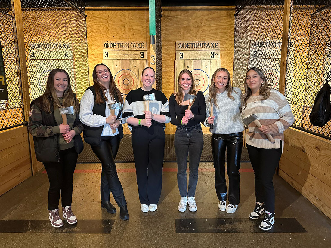 Six female Falk SPM students at axe throwing excursion
