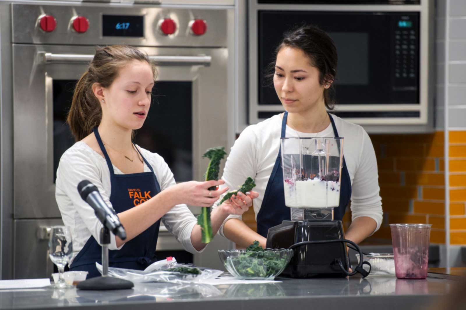 Two students cooking in a lab