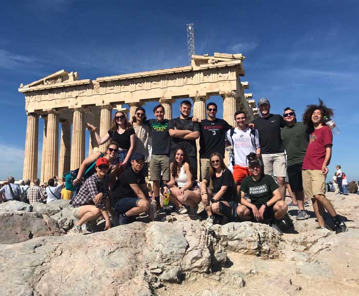 Students pose in front of the Knowledge result Parthenon in Greece