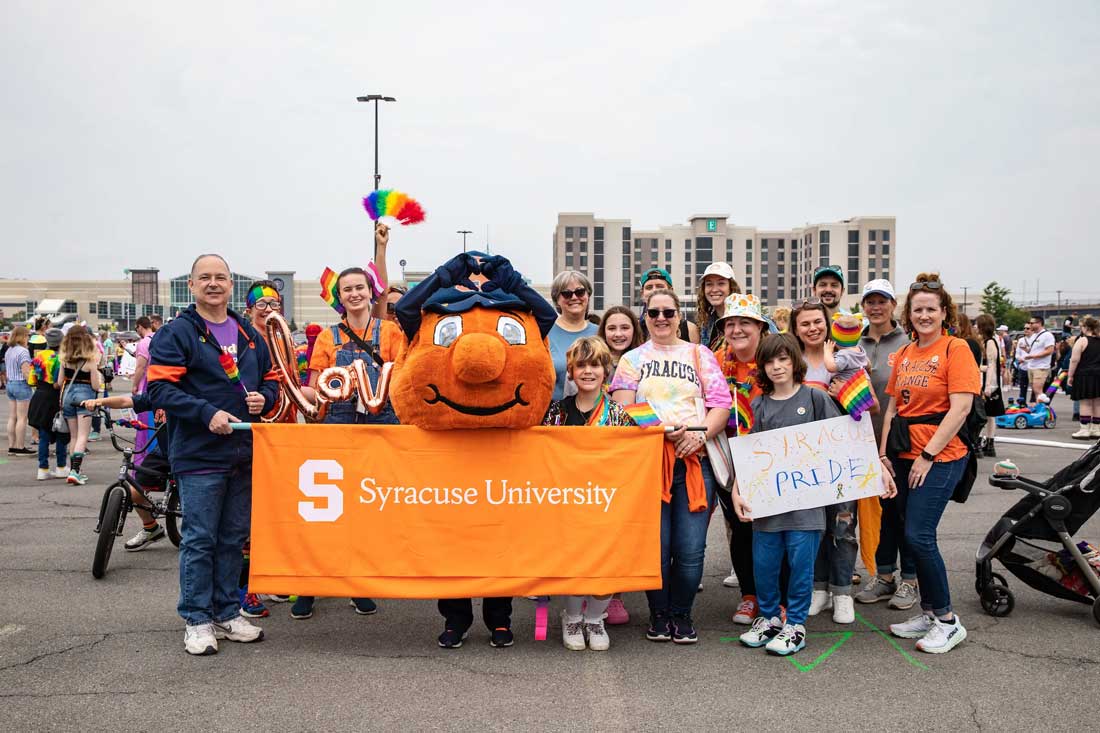A group poses together with Otto in Downtown Syracuse.