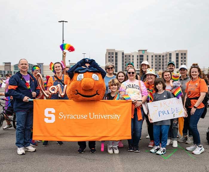 A group poses together with Otto in Downtown Syracuse.