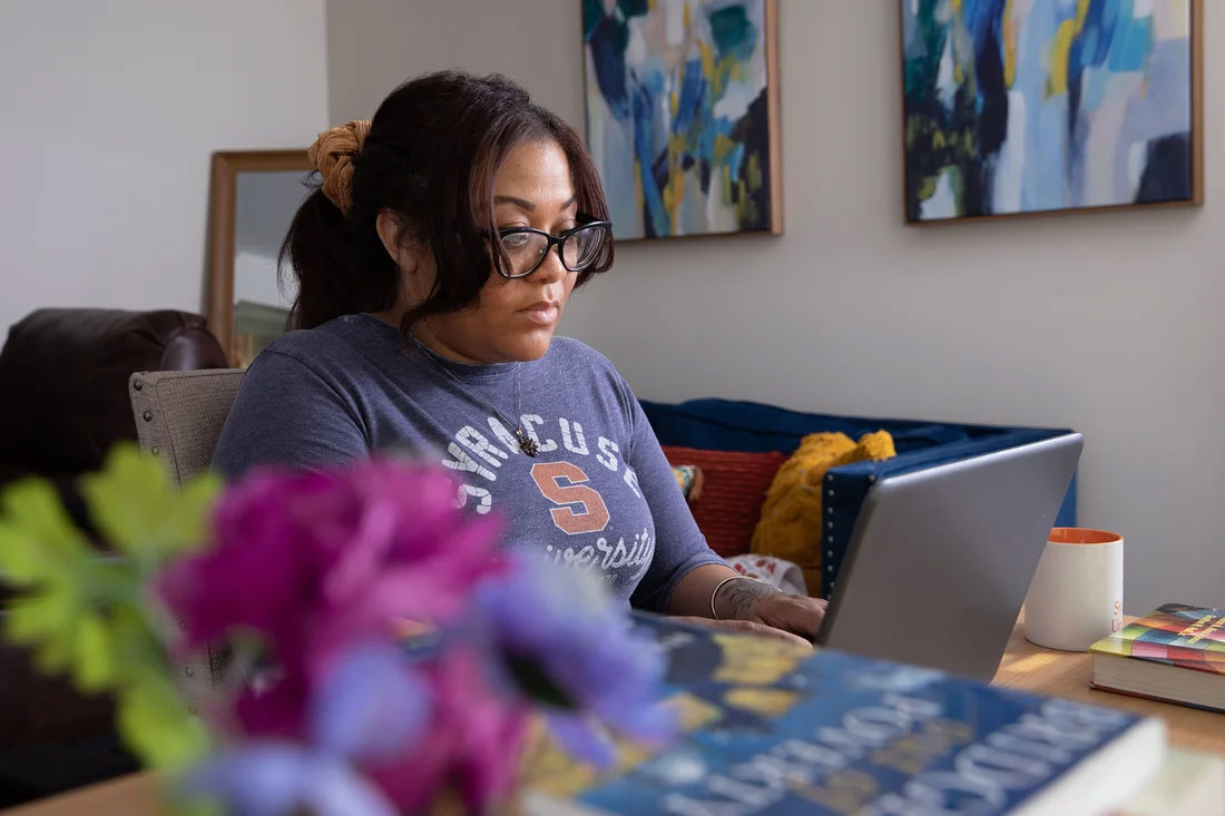 Ashlee at a desk with a computer