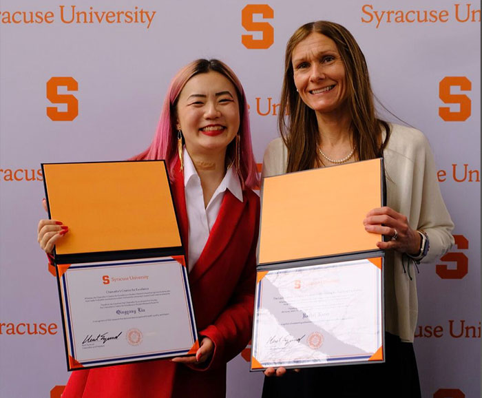 Liu and Razza holding award certificates
