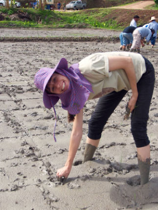 Rebecca Garofano stands in a muddy field